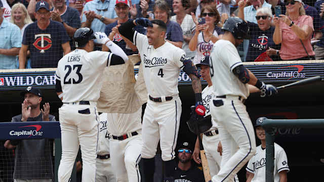 Oct 3, 2023; Minneapolis, Minnesota, USA; Minnesota Twins short stop Royce Lewis (23) celebrates with shortstop Carlos Correa after hitting a home run in the third inning against the Toronto Blue Jays during game one of the Wildcard series for the 2023 MLB playoffs at Target Field.
